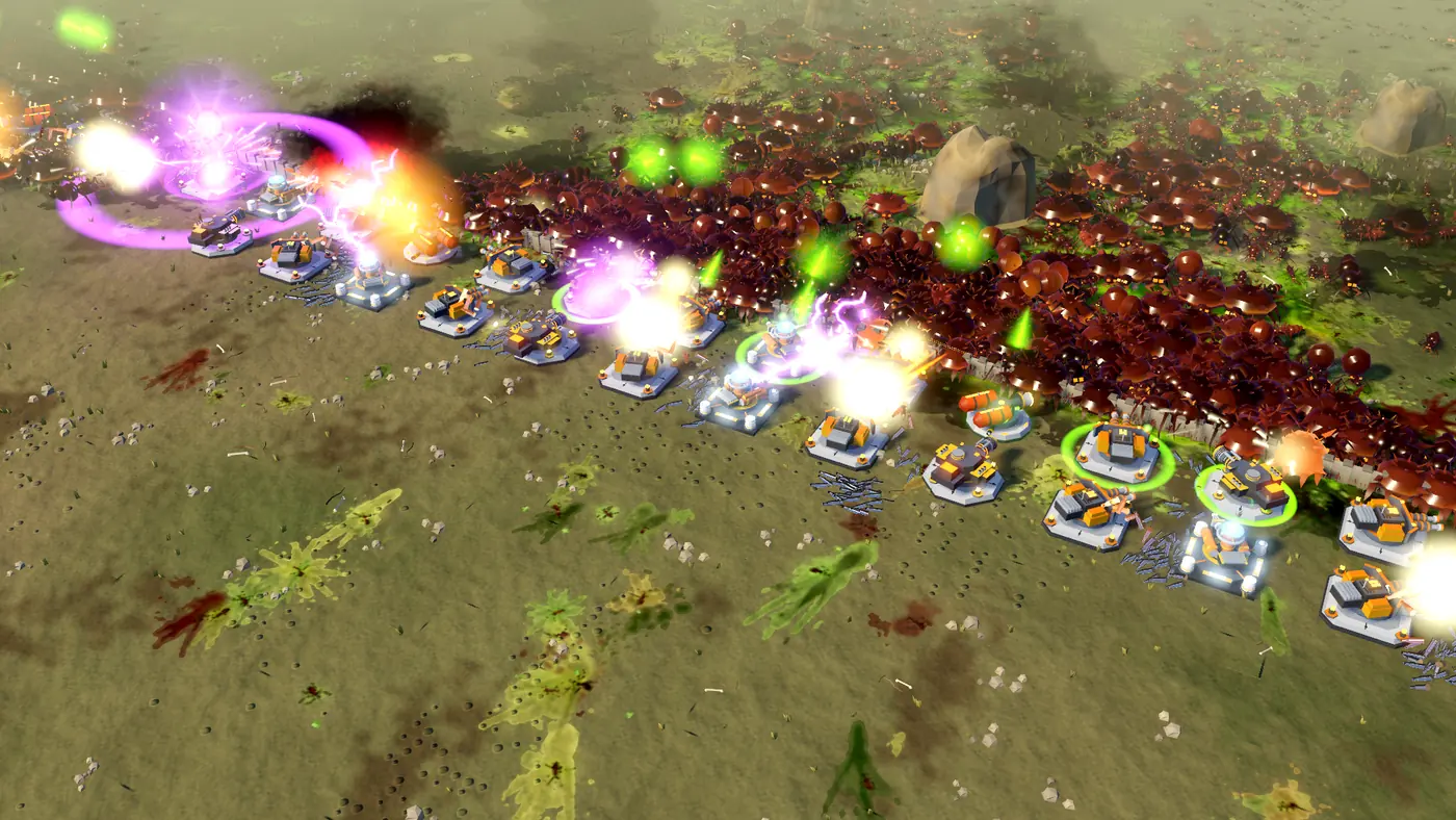 A long line of towers and walls firing into an advancing swarm